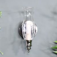 Old Style Gas Lamp Bathroom Wall Light on a Blue Wall