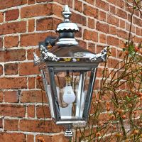 Close-up of the Top Fixing On The Bright Chrome Wall Lantern
