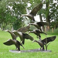 Flying Duck Sculpture in a Bronze Finish 