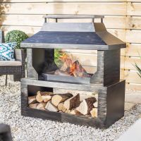 Bronze Wood Burner and Log Store in Use Burning Wood