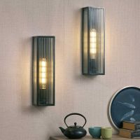 Bronze Reeded Glass Wall Light in Situ on a Pink Wall