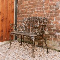 "Chorley" Brushed Gold Bench in the Garden