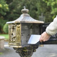 Front Opening in Use on Brushed Gold Freestanding Post Box