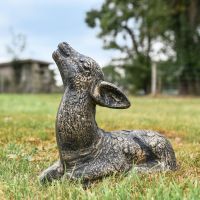 Brushed Gold Recycled Cast Aluminium Baby Deer Sculpture - Lying Down in Situ
