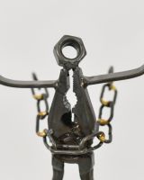 Close up of intricate detail on recycled metal art sculpture