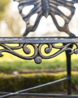 Close Up Of Butterfly Design Two Seater Bench Scrollwork