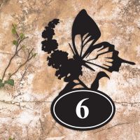 Butterfly Iron House Number Sign in Situ on a Rustic Wall 