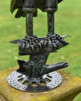 Close up of feet detail recycled metal art sculpture
