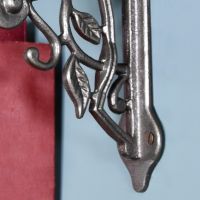 Close up of iron shelf bracket and mounting arm