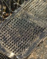 Close-Up of Seat on Cast Aluminium "Halter" Two Seater Garden Bench