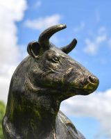 Close-Up of Cast Aluminium Laying Cow Sculpture