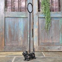 Cast Iron Dog Door Porter in Situ by a Rustic Door