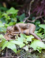Serene Cast Iron Sleeping Woman Sculpture