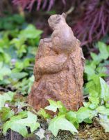 Details of Rustic Cast Iron Squirrel on Log Sculpture