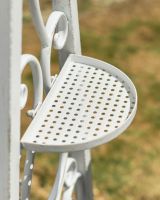 Close up of cupholder side table detail on patio swing seat