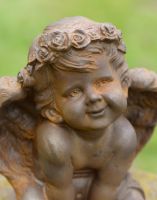 Close-up of Cast Iron Smiling Cherub Garden Sculpture