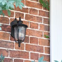 "Christleton" Bronze Wall Mounted Porch Light in Use by the Front Door of a House