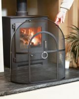 Scale Shot Of Classic Black Arched Fire Guard with Circular Handle