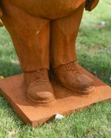 Close up of intricate shoes detail on tweedledee and tweedledum garden sculptures