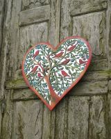 Angled view of intricate rustic finish steel detail garden wall art