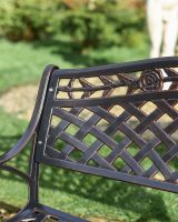 Roses on copper bench close up 