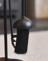 Close up of brush on fireside companion set