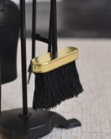 Close up of brush on fireside companion set