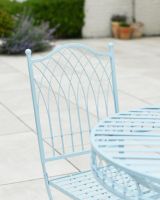 Close up of ornate chair back detail on patio two seater furniture set