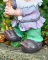 Close up of clothes detail on colourful outdoor gnome sculpture