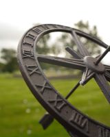 Close up of intricate numerals on rustic armillary