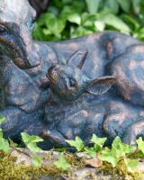 Close up of doe detail in fawn and doe garden statue