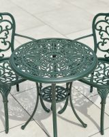 Close up of intricate table top detail and parasol hole in outdoor bistro set