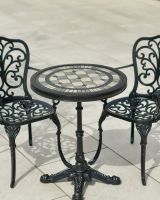 Close up of of mosaic tiled garden table and chairs set