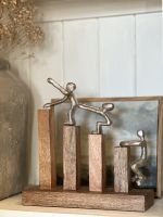 Close up of silver figures on interior ornaments