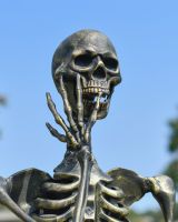 Close up of intricate face detail on skeleton garden sculpture