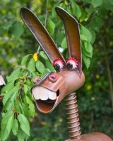 Close up of intricate face detail on recycled metal donkey outdoor sculpture