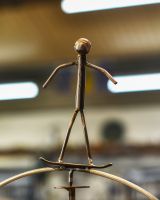 Close up of skateboarding figure detail on scrap metal home decor sculpture