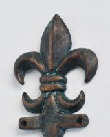 Close up of intricate verdigris detail on Fleur-De-Lis Hook