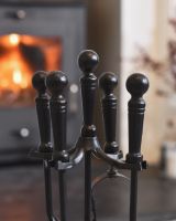 Close up of handles on black fireside companion set
