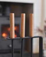 Close up of wooden handle on fireside companion set