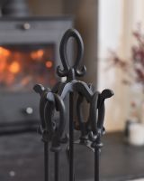 Close up of intricate handle detail on fireside companion set