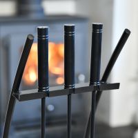 Close up of sturdy handle detail on contemporary black companion set