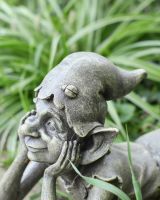 Close up of hat detail on resin garden statue