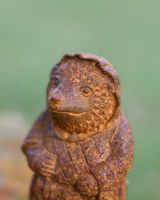 Close up of face detail on hedgehog rustic finish garden ornament