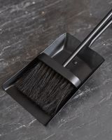 Close up of brush in fireside brush and shovel set