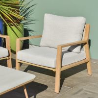 Close up of individual armchair on six piece garden lounge furniture set Close up of individual armchair on six piece garden lounge furniture set