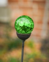 Close up of vibrant green marble detail on plant pot stakes