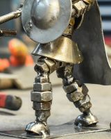 Close up of intricate body detail on scrap metal art sculpture