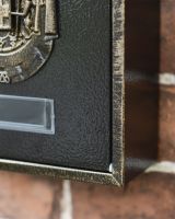 Gold and Black Close up of Post Box 