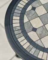Close up of mosaic tiles tabletop detail on garden table and chairs set